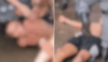 No início do vídeo, é possível ver o homem com as mãos para trás, encostado cont