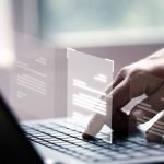 hand-using-laptop-computer-with-virtual-screen-document-online-approve-paperless-quality-assurance-erp-management-concept-848x477-1