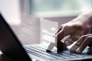 hand-using-laptop-computer-with-virtual-screen-document-online-approve-paperless-quality-assurance-erp-management-concept-848x477-1