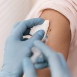 high_angle_patient_getting_their_vaccine-36405921