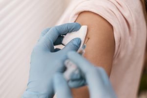 high_angle_patient_getting_their_vaccine-36405921