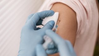 high_angle_patient_getting_their_vaccine-36405921