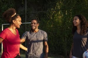 medium_shot_friends_soccer_field-36889881