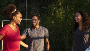 medium_shot_friends_soccer_field-36889881